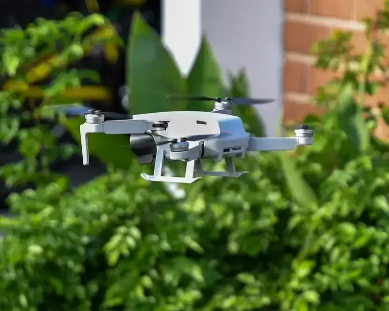 Drone in flight capturing 4K footage of a roof cleaning in Orlando, Florida